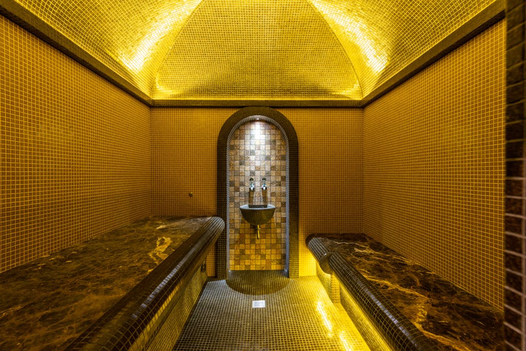 Bathhouse Interior with a Sink and Seats