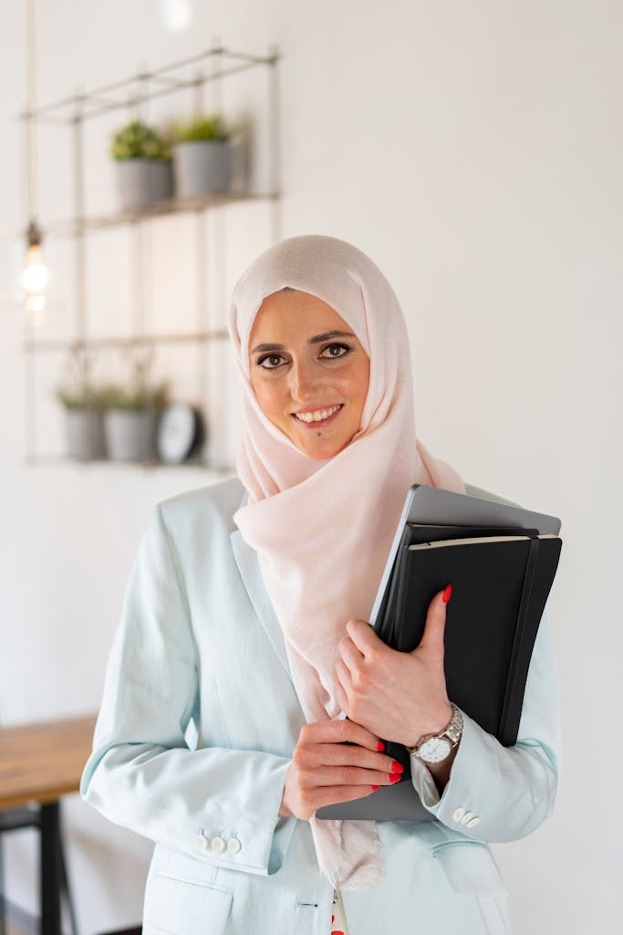 Woman in White Hijab Holding Black Tablet Computer