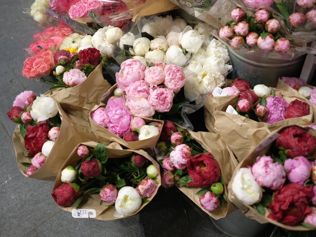 A bunch of flowers in brown paper bags